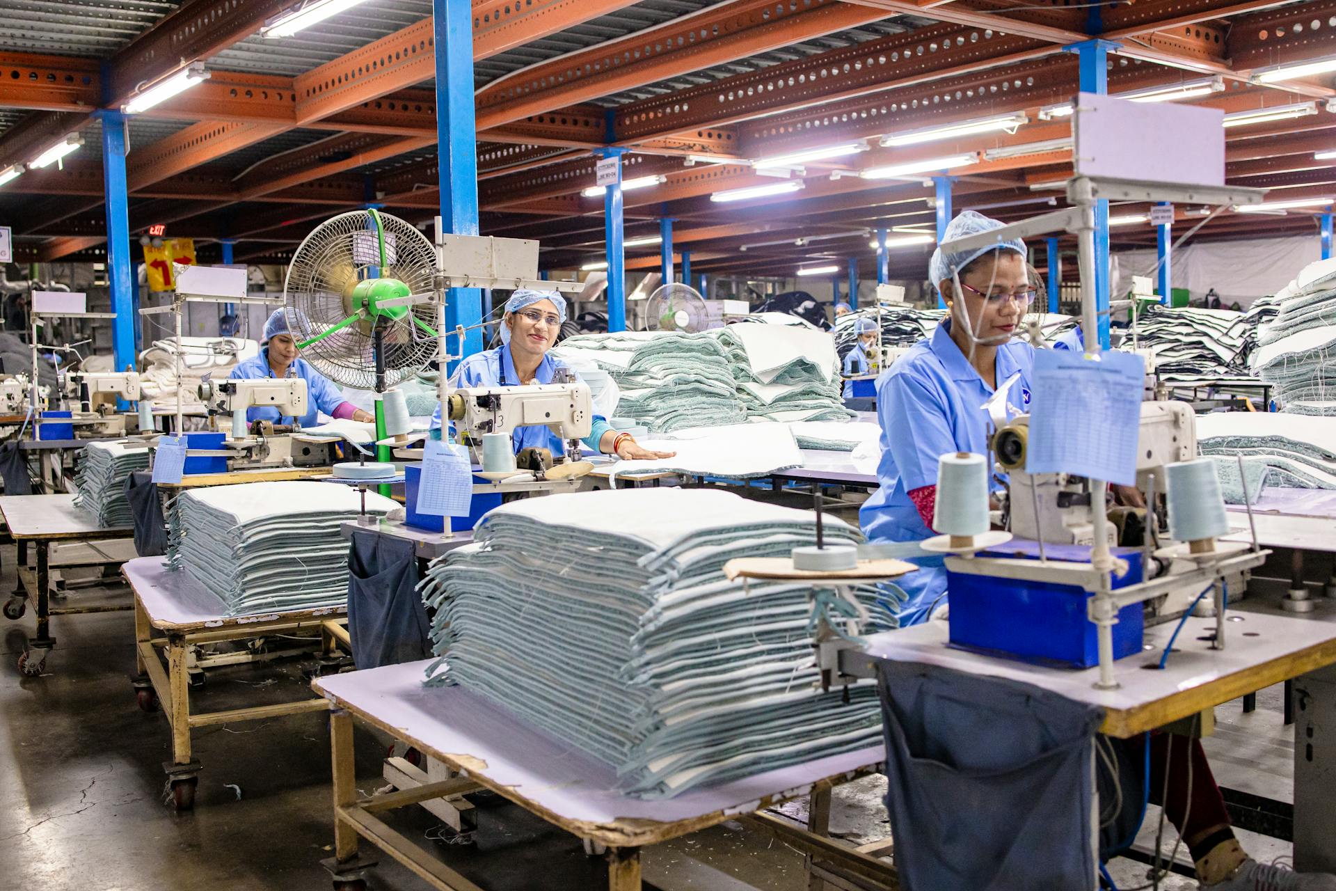 Dense rows of garments representing overproduction
